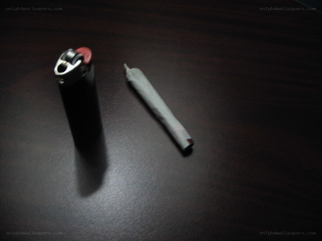 cigarette and lighter on table