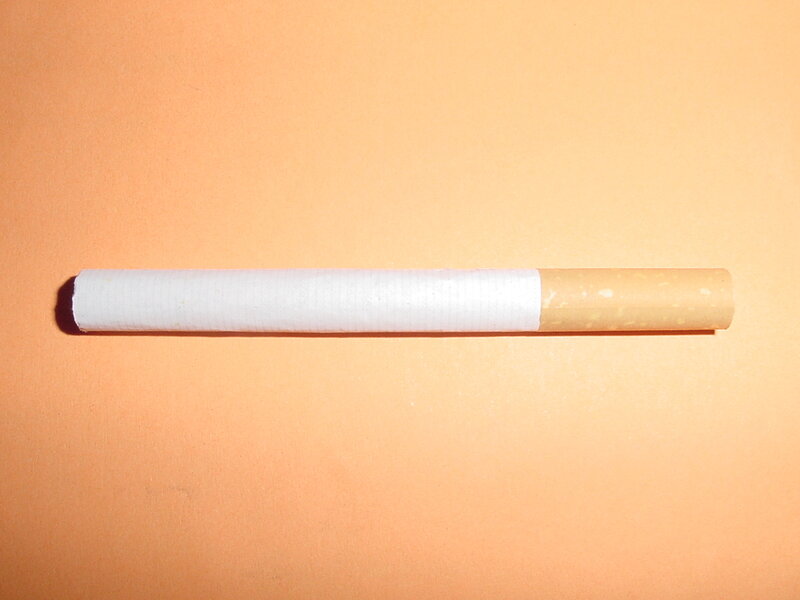 cigarette on orange surface