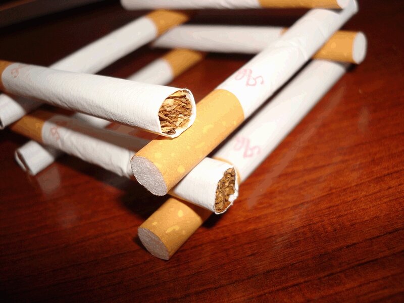 Cigarettes on wooden surface