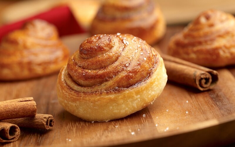 Cinnamon buns on wooden board