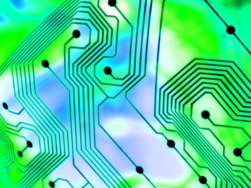 circuit board with green and blue glow
