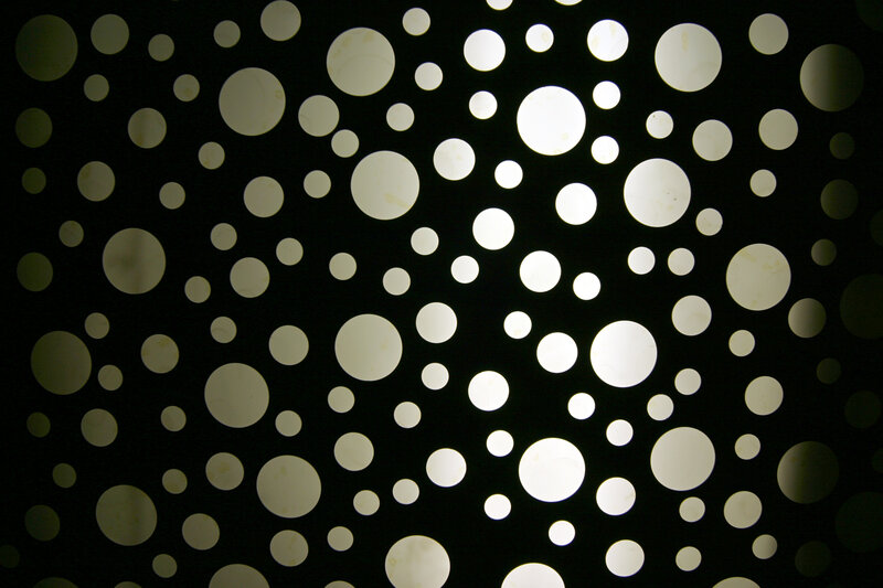 Circular Cutouts on Black Surface