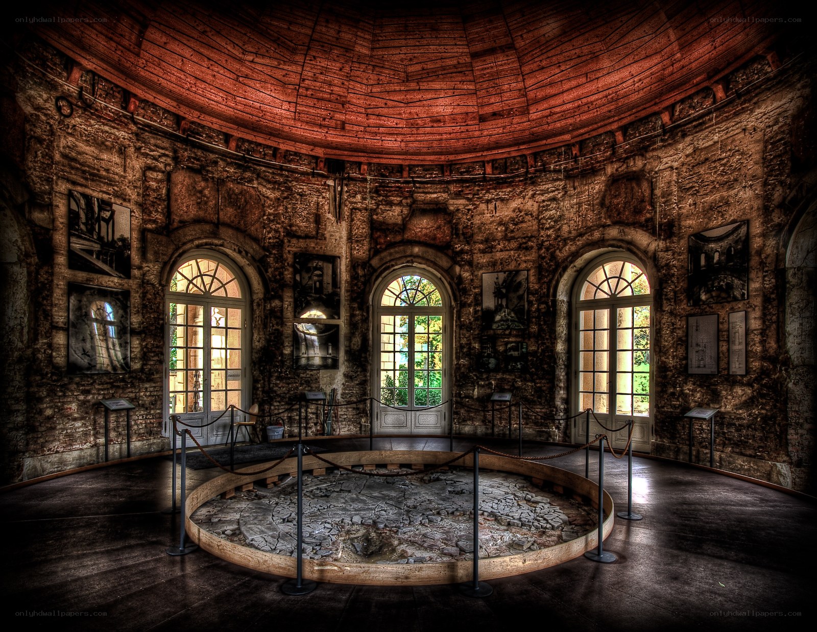 Circular stone room with arched windows