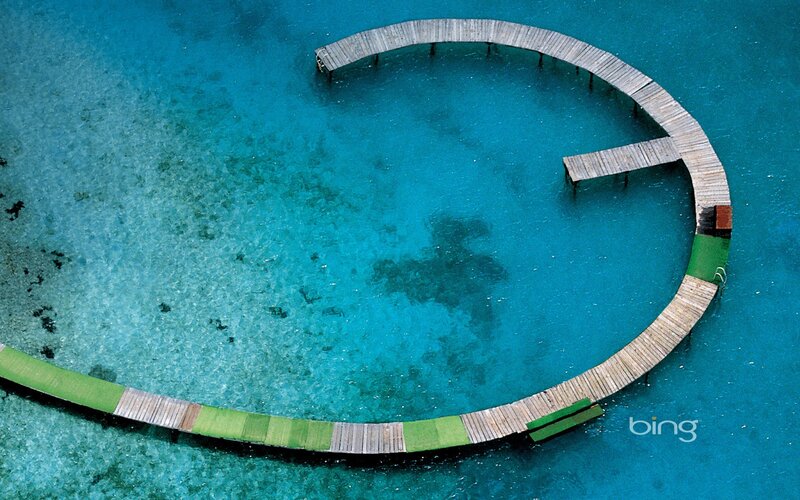 Circular wooden pier in turquoise water
