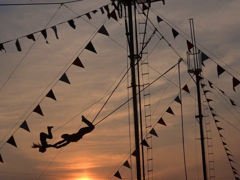 Circus acrobats at sunset