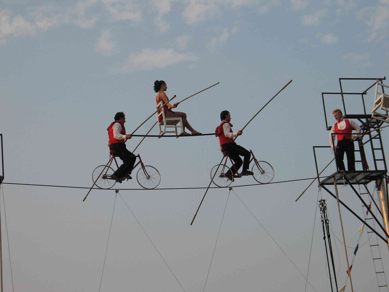 Circus performers on a high wire