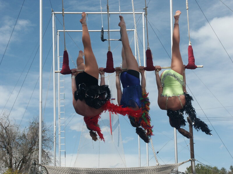 Circus performers on trapeze