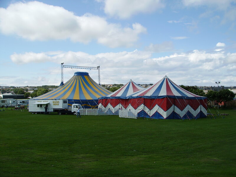 Circus tents on a grassy field