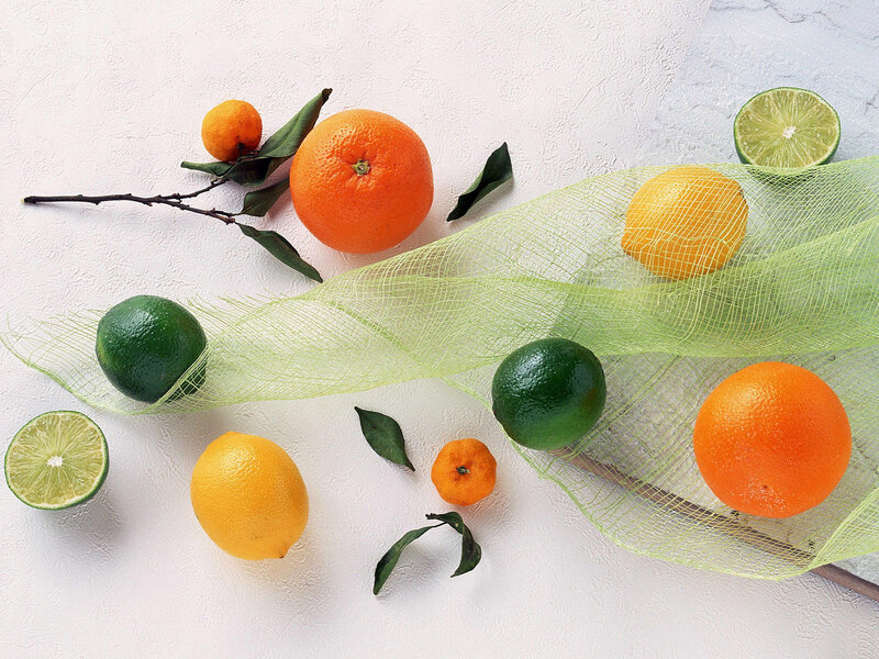 Citrus fruits on white surface