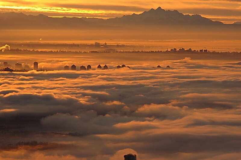 City above the clouds at sunrise