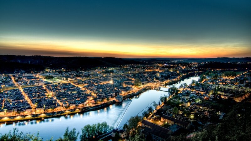 City Along River at Dusk