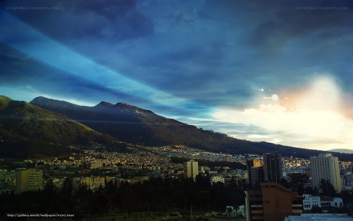 City at dusk with mountains