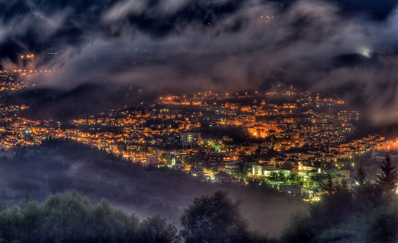 City at Night in Mountains