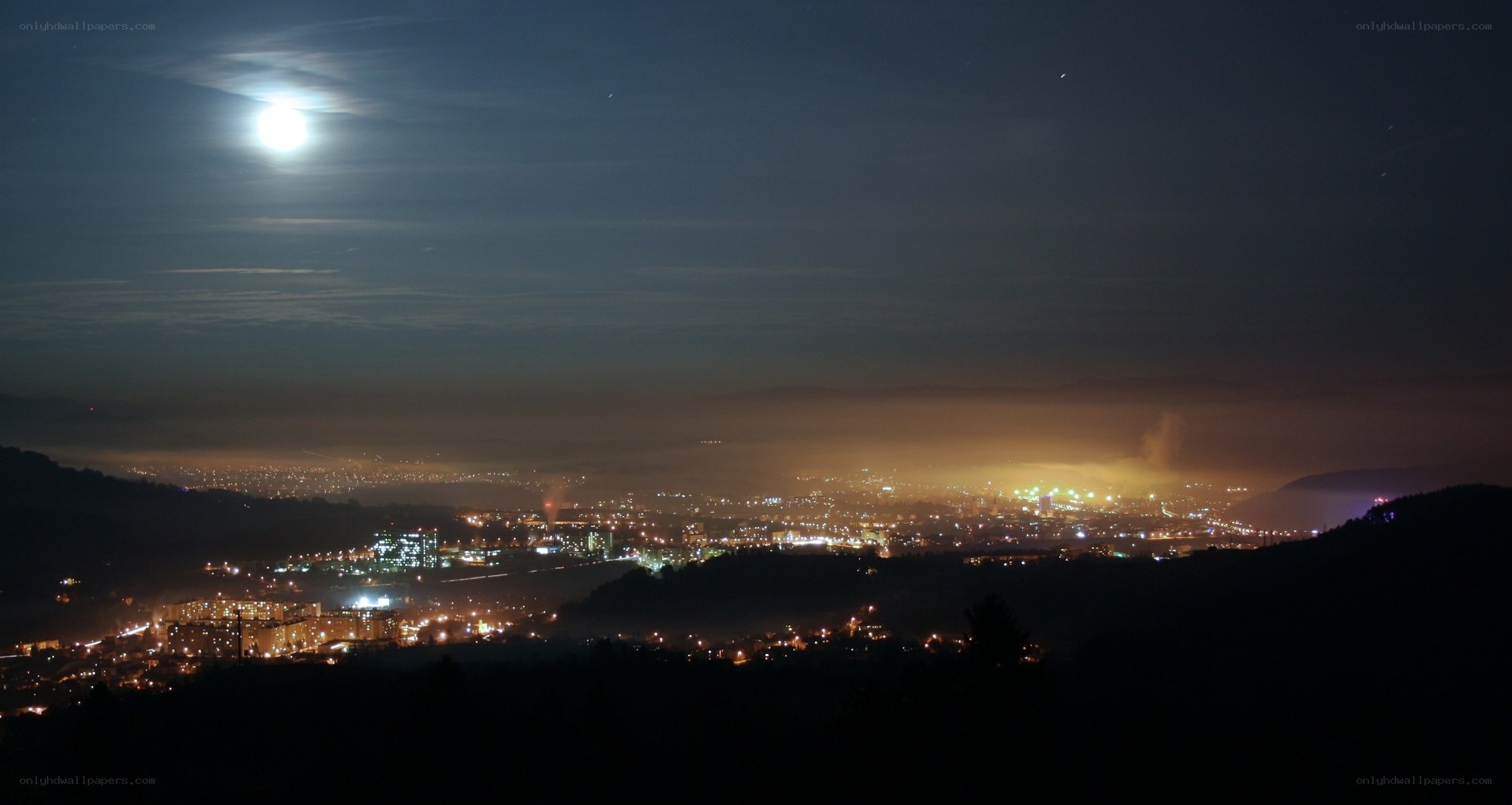 City at night under moonlight