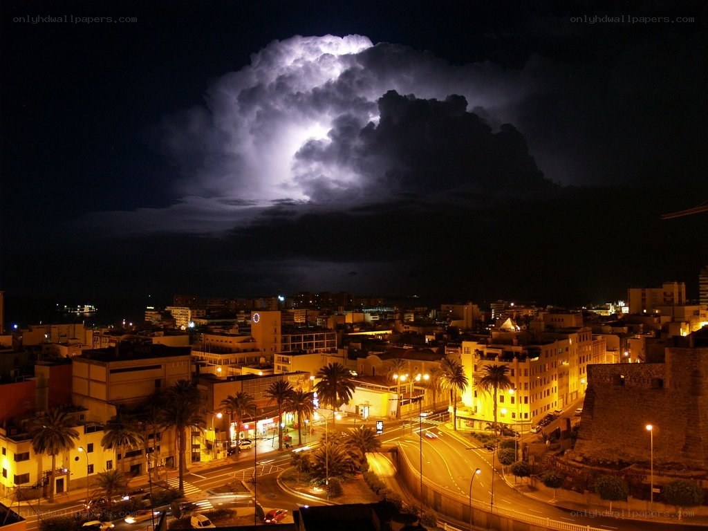 City at night with lightning storm