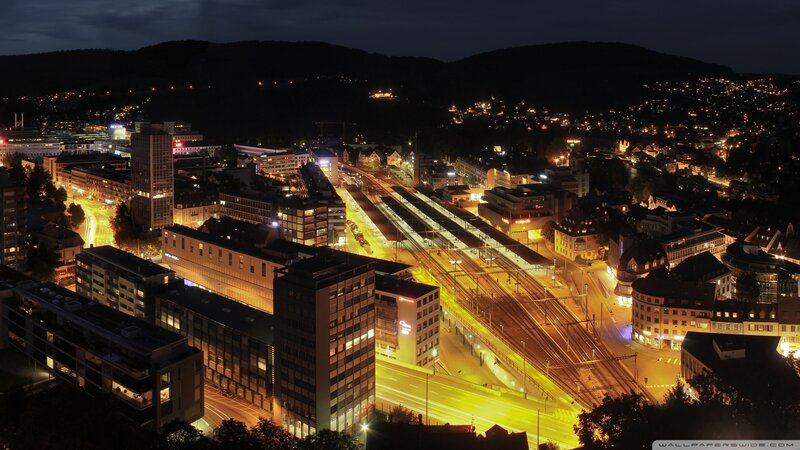 City at Night with Train Station