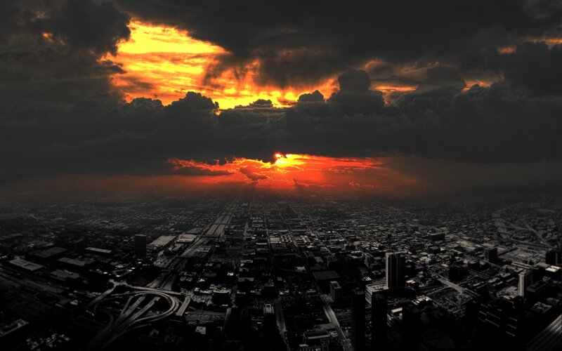 city at sunset with dramatic sky