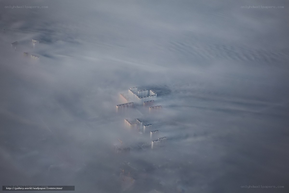 City buildings in fog