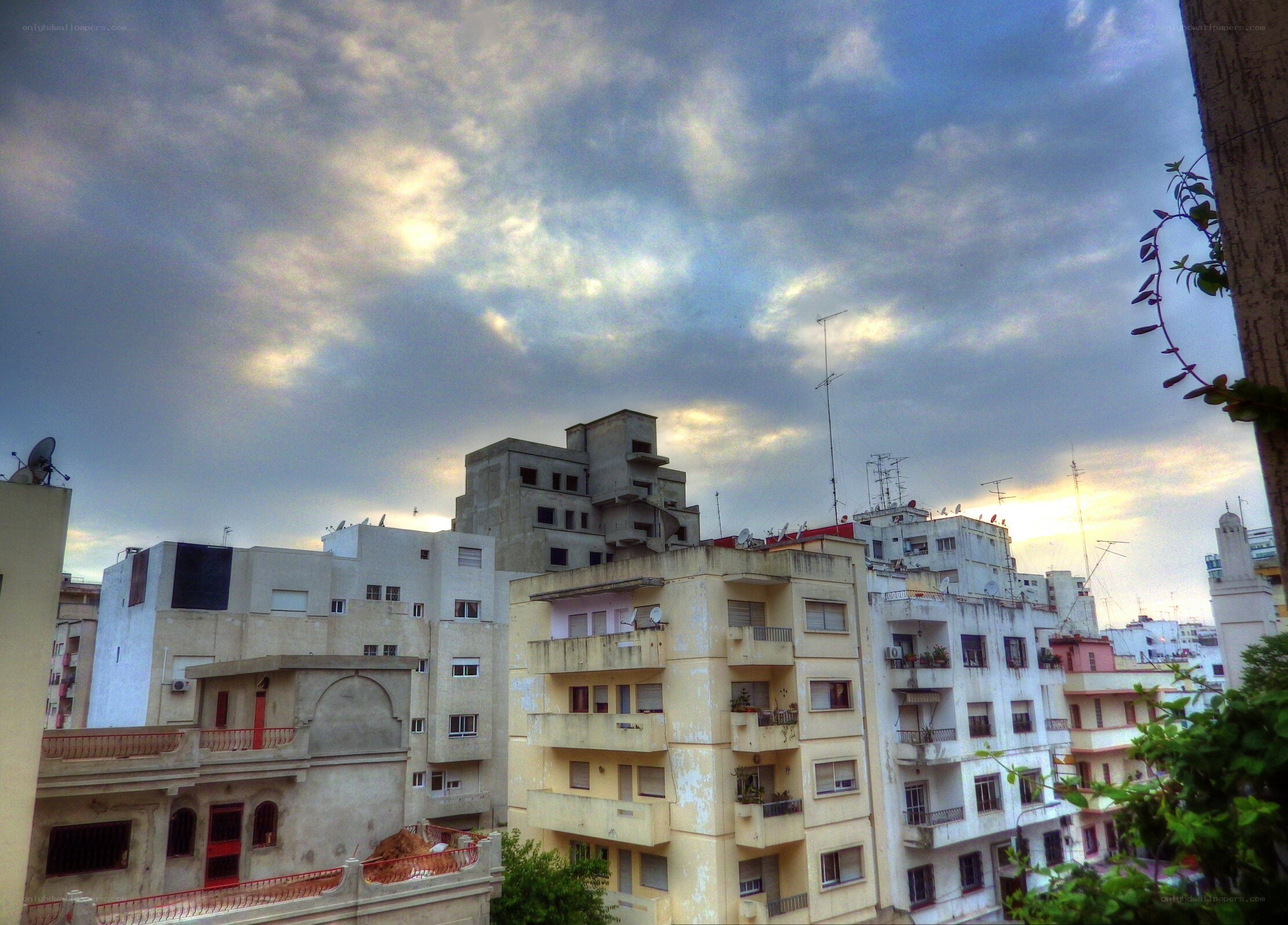 City buildings under cloudy sky