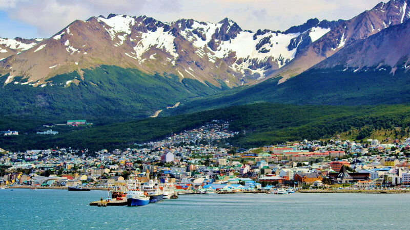 City by Snow-capped Mountains