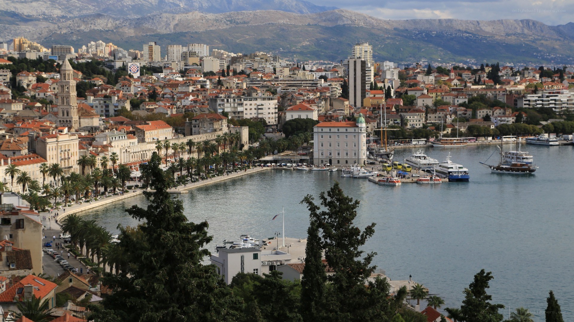 city by the sea with mountains