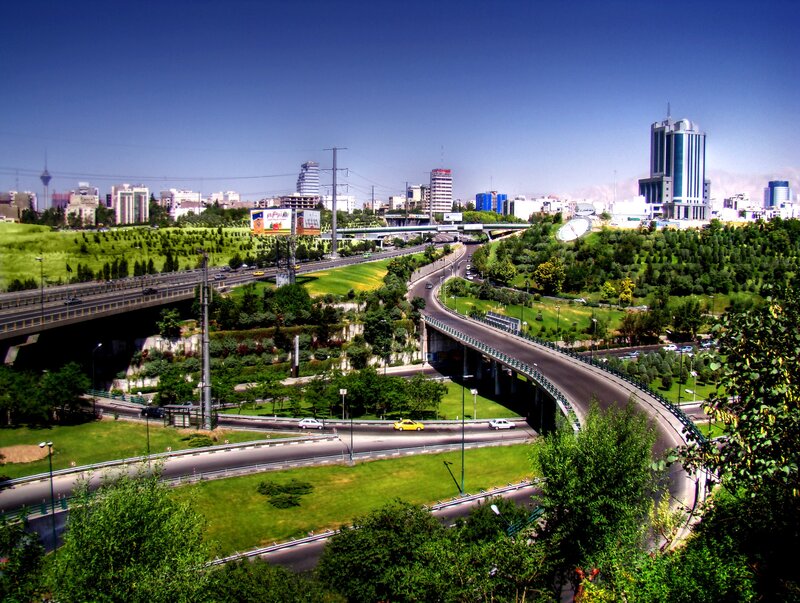 City highway interchange with green hills