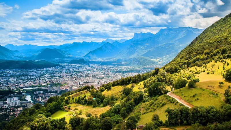 City in Mountain Valley — Green, Serene, Afternoon, Photograph