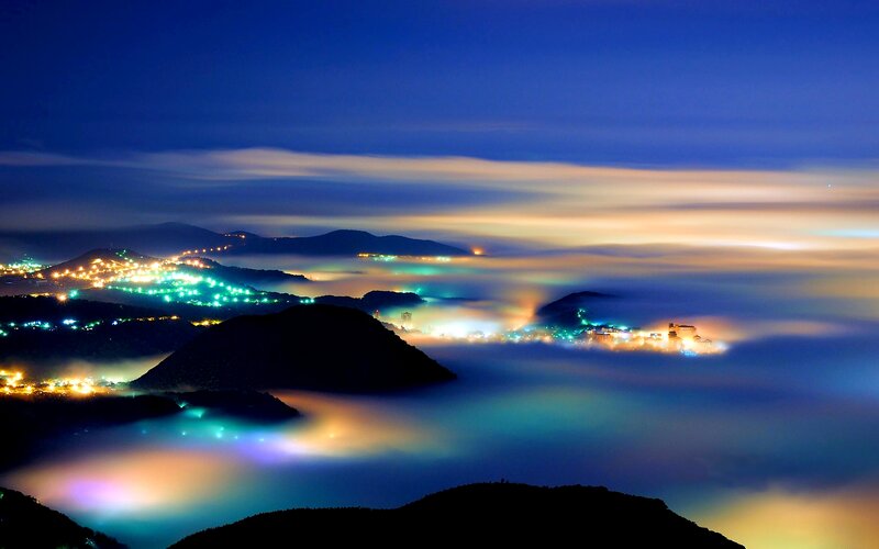 City Lights Above Clouds