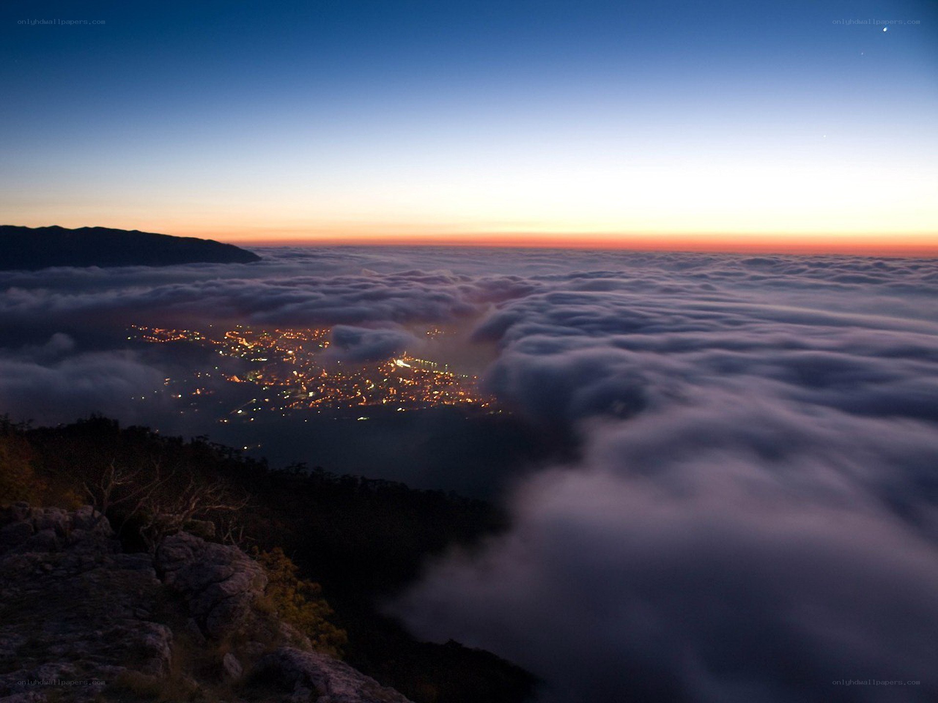 City lights above the clouds