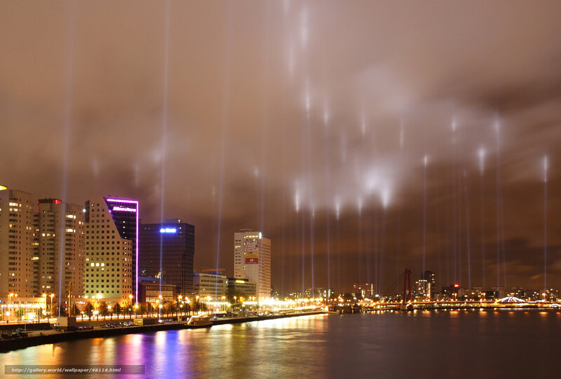 City lights and laser beams at night