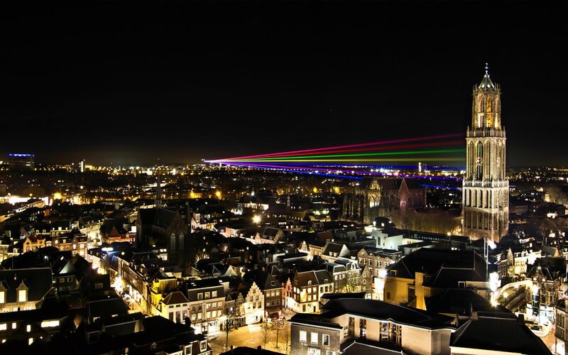 City lights and laser show at night