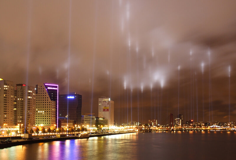 City lights and light beams at night