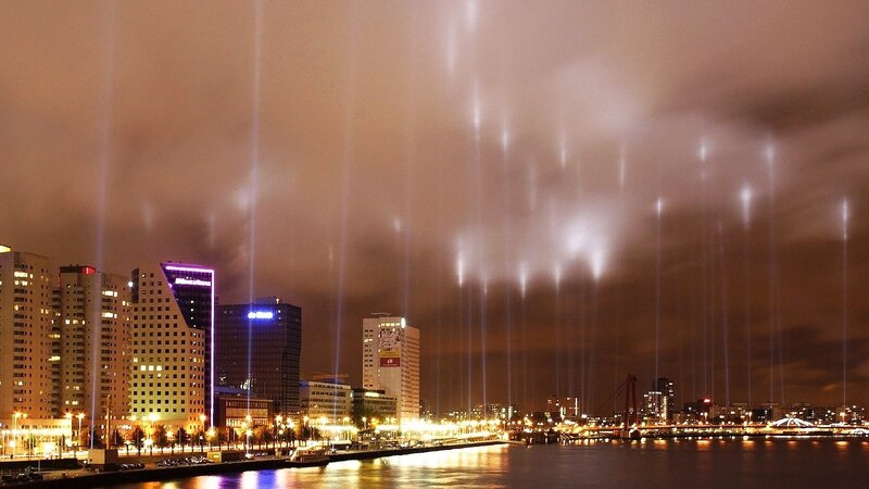 City lights and light beams at night