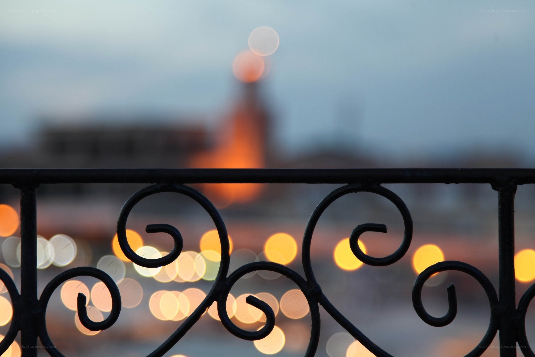 City lights at dusk from balcony