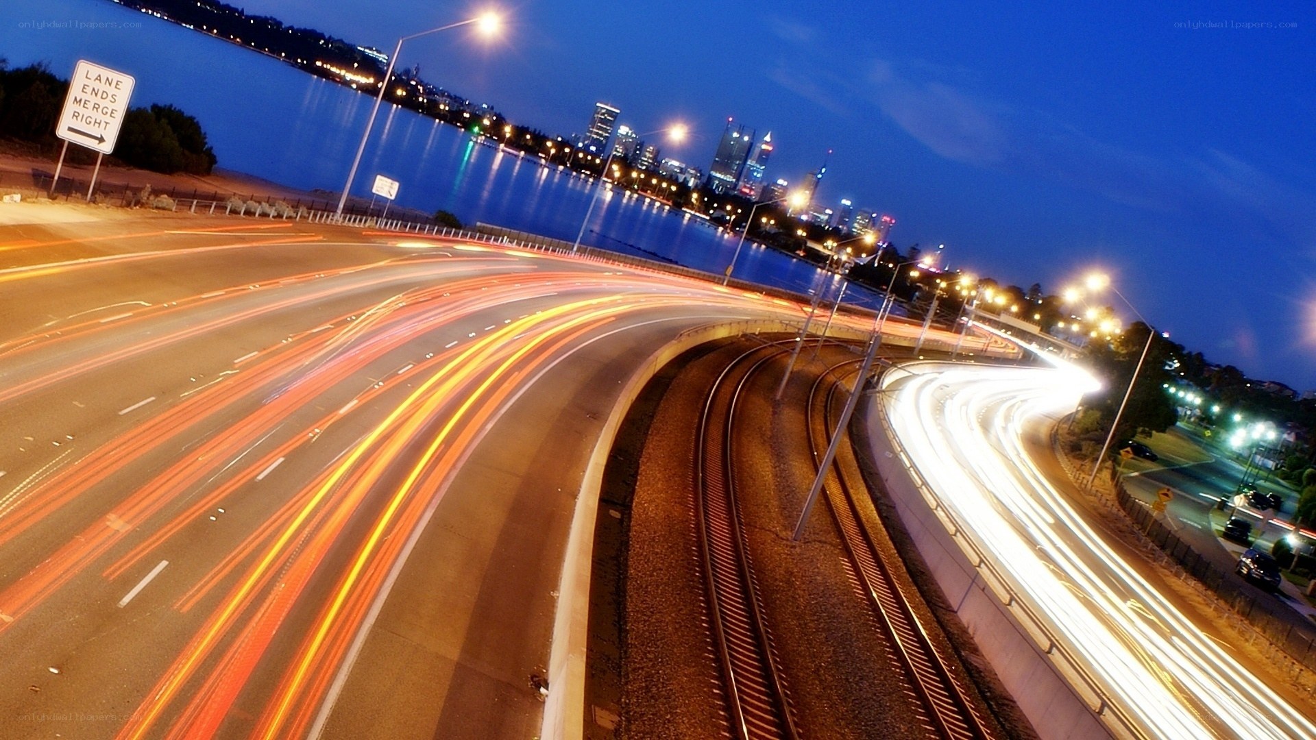 City lights at dusk with traffic trails