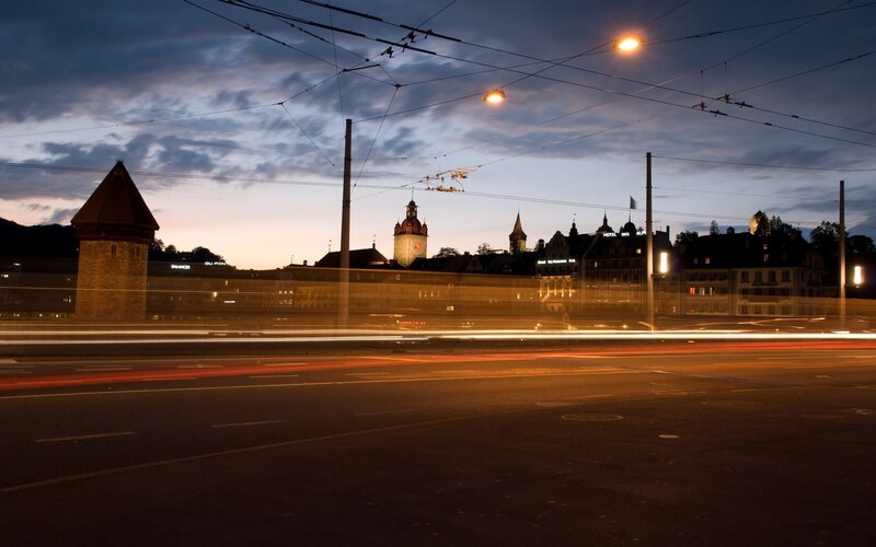 City lights at dusk with tram tracks