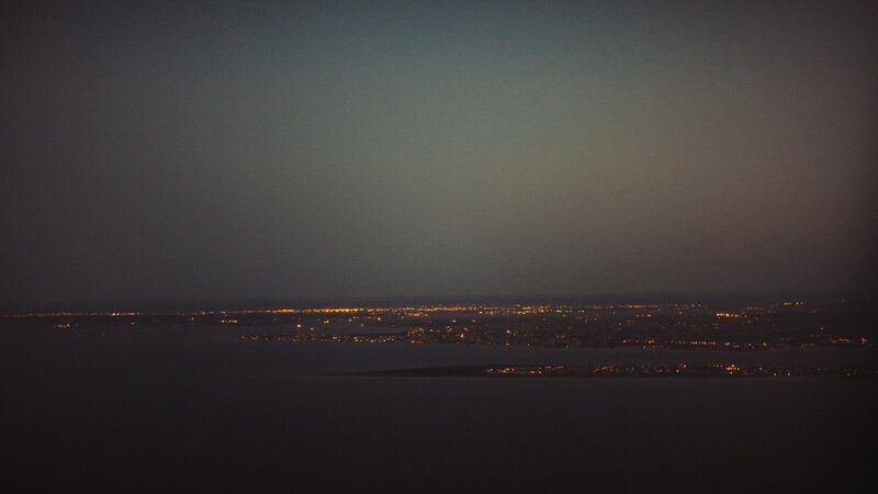 City Lights at Night — Black, Calm, Photograph, Water