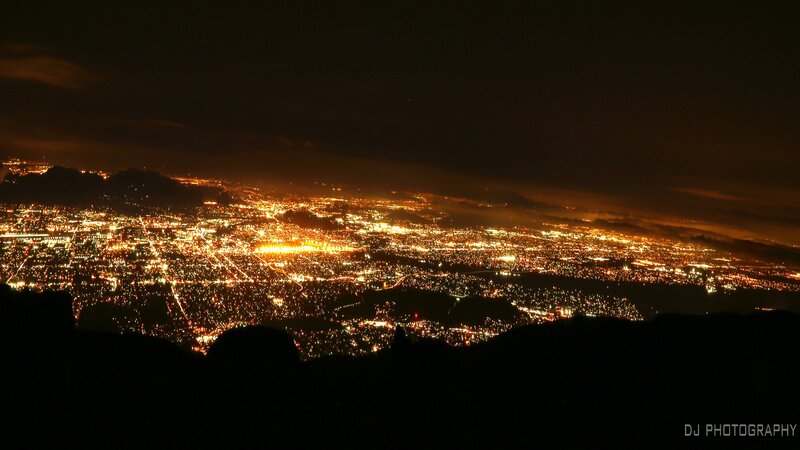 City Lights at Night — Black, Dramatic, Photograph, Mountain