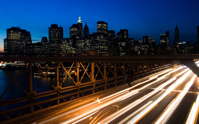 City lights at night from a bridge