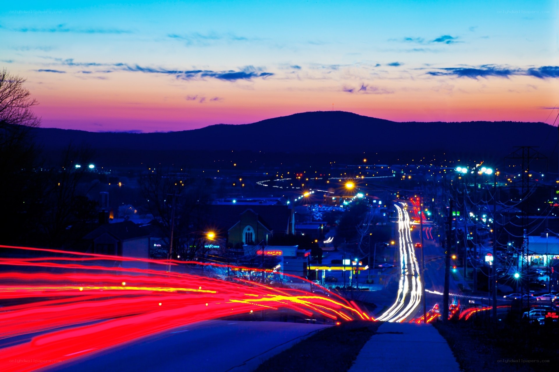 City lights at twilight with light trails