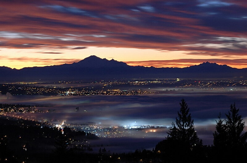 City lights over foggy valley