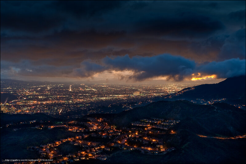 City lights under stormy sky
