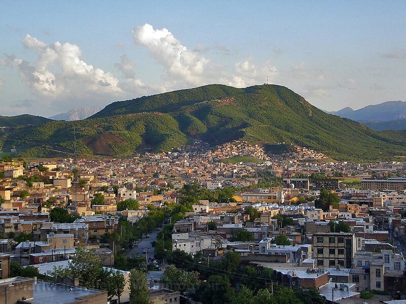 city nestled in green hills