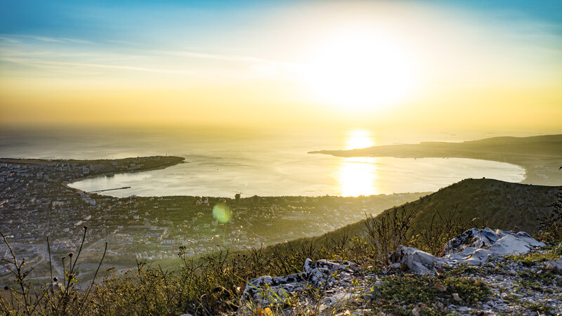 City Overlooking Bay at Sunset