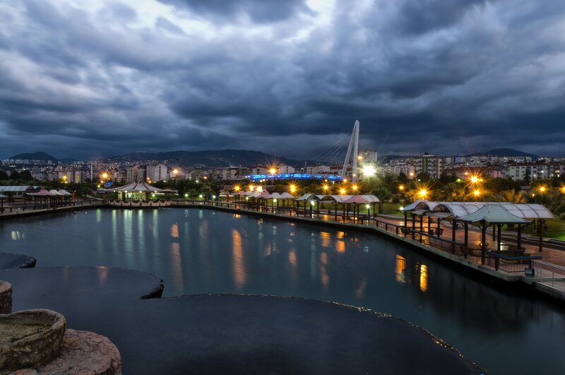 City park at dusk with lake