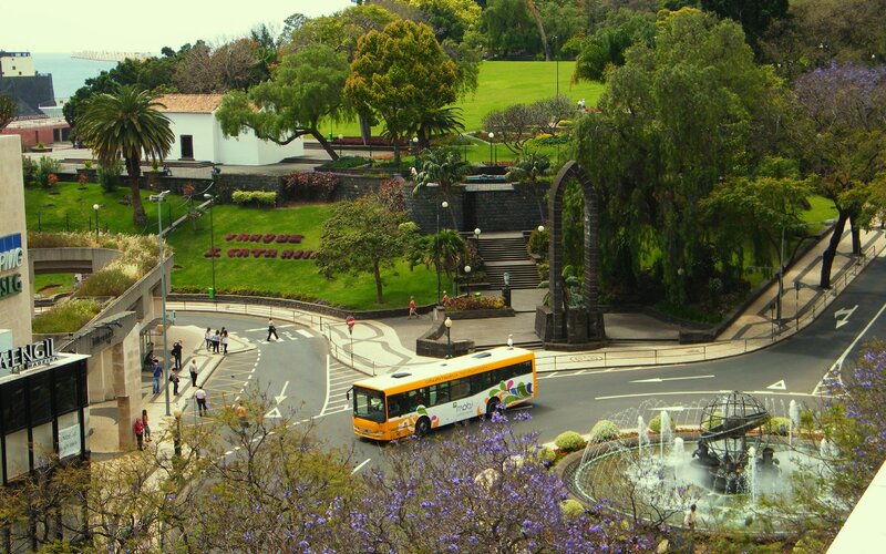 City park with bus and fountain