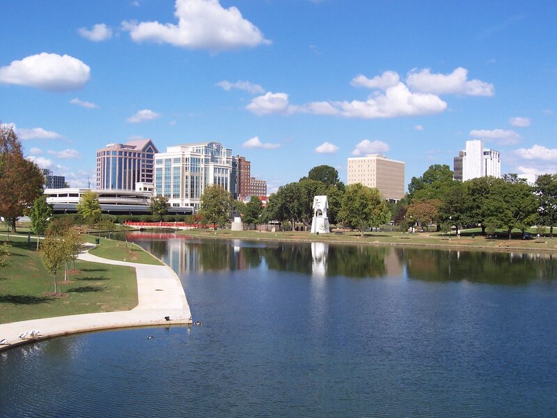 City park with lake and skyline