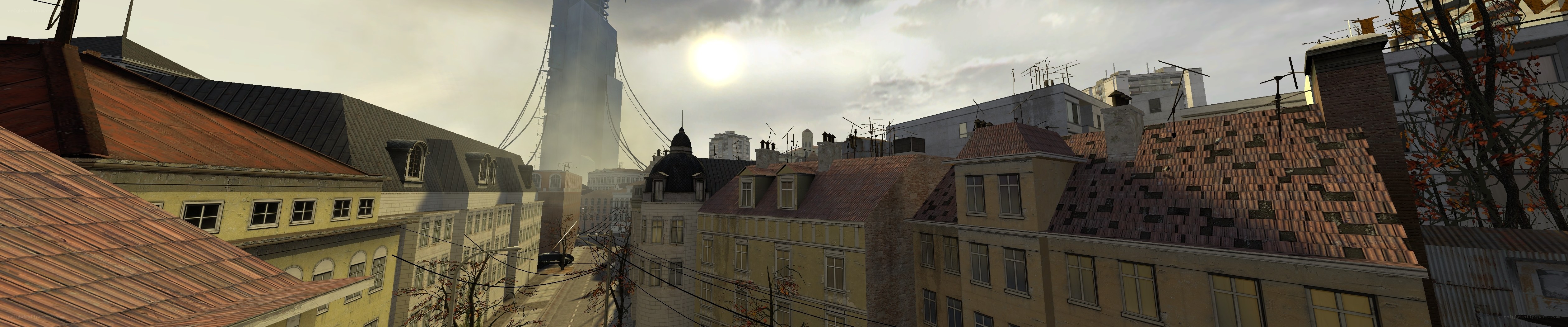 city rooftops with bridge in distance