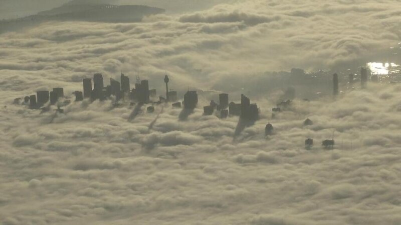 City Skyline Above Clouds — Gray