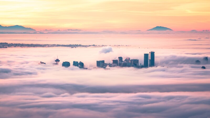City Skyline Above Clouds — Pink